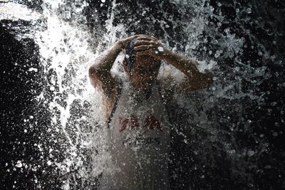 Man enjoying waterfall