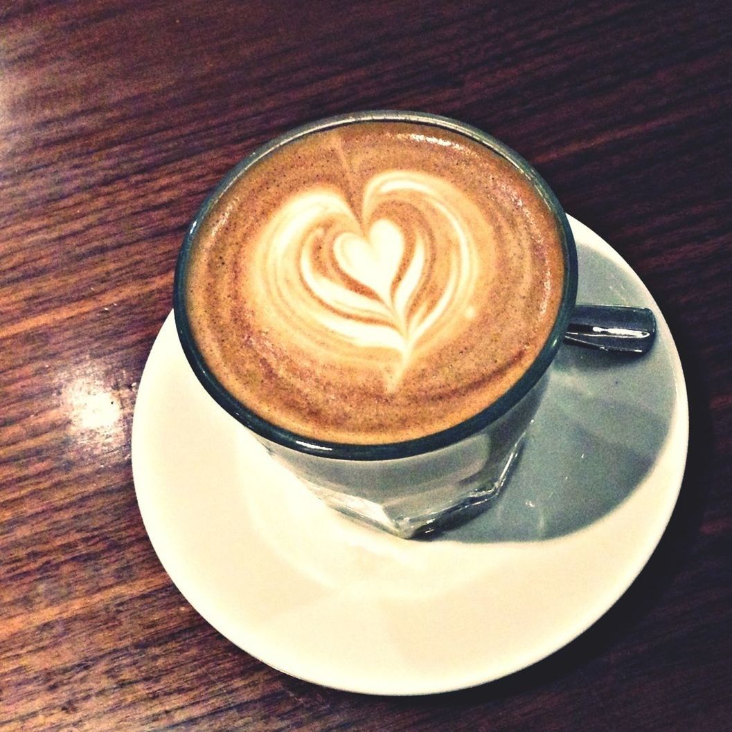 coffee cup, froth art, drink, refreshment, saucer, cappuccino, coffee - drink, food and drink, frothy drink, indoors, table, freshness, latte, coffee, heart shape, art, still life, creativity, close-up, design