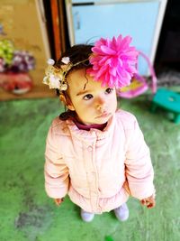 Close-up portrait of cute girl standing against water