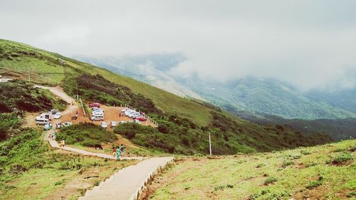 View of village against cloudy sky