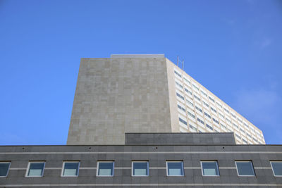 Low angle view of building against clear blue sky