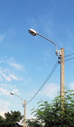 Low angle view of street light against sky