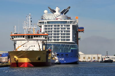 Ship moored in sea against sky