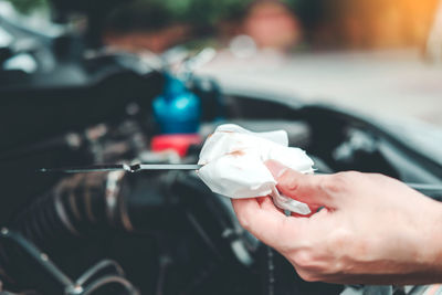 Close-up of hand holding ice cream in car