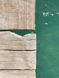 High angle view of book on table by swimming pool