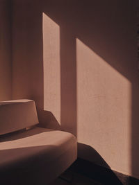 Shadow of person on table against wall at home