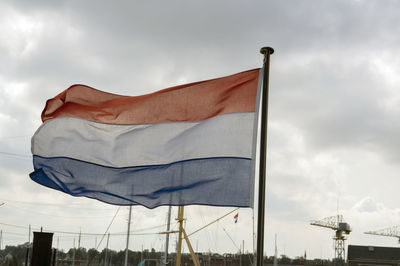 Low angle view of flag against sky