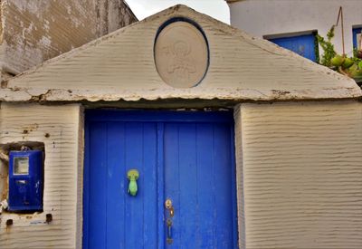 Closed blue door of building