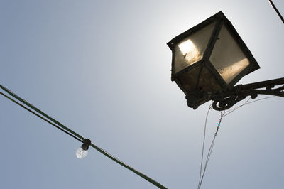 Low angle view of street light against sky