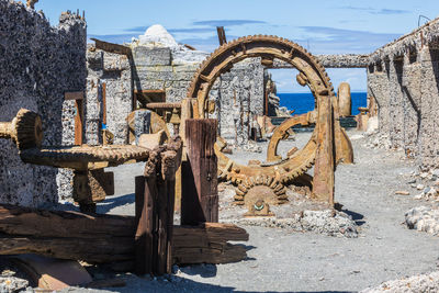 View of old rusty factory white island for  removal of sulfur with view to the ocean in background