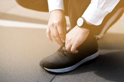 Low section of woman walking on floor