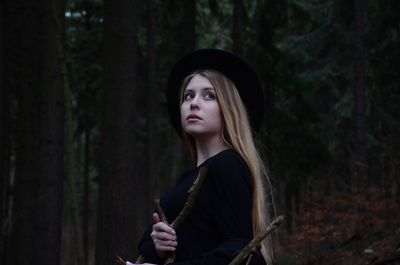 Portrait of young woman in forest