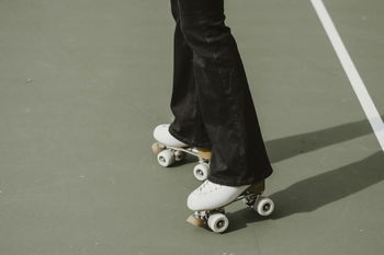 Low section of woman skating on rollelskate