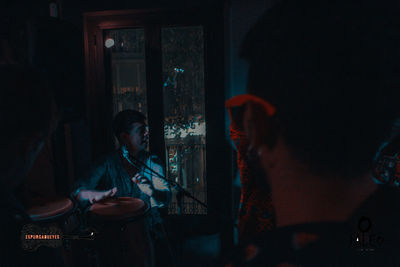 People playing guitar at home