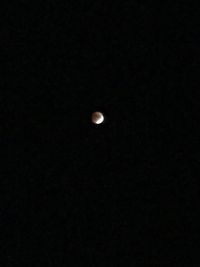 Low angle view of moon against sky at night