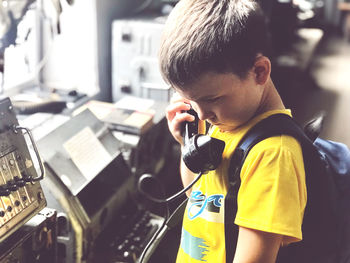 Angry boy talking on phone