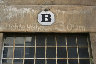 Low angle view of sign on wall