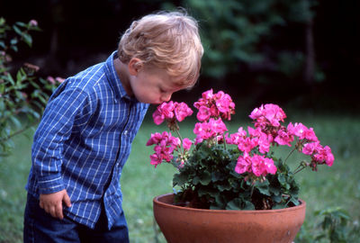 Rear view of man and potted plant