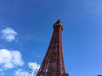 Low angle view of blackpool tower against blue sky