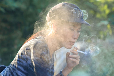 Portrait of man smoking cigarette