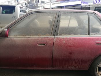 Close-up of car on street