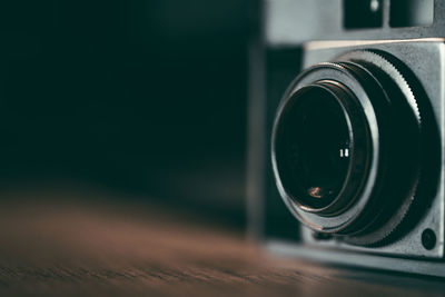 Close-up of analog camera on table