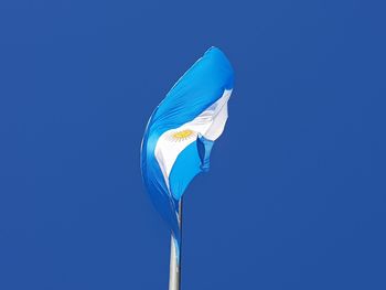 Low angle view of argentinian flag against the sky