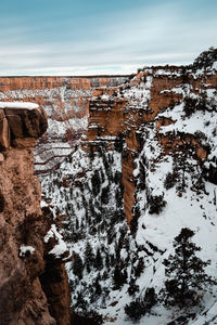 Aerial view of rocks against sky during winter