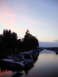 Scenic view of calm lake at sunset