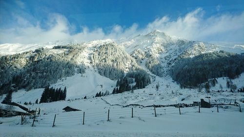 Scenic view of mountains against sky during winter