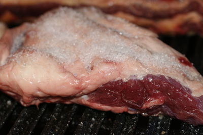 Close-up of fish on barbecue grill