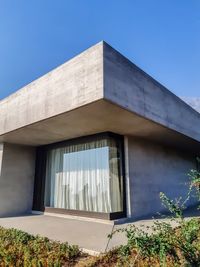 Low angle view of building against blue sky
