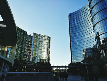 Low angle view of skyscrapers against clear sky