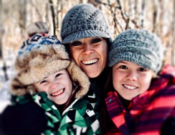 Portrait of smiling family during winter