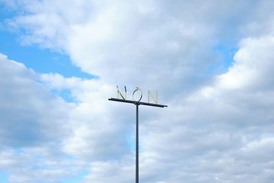 Low angle view of street light against cloudy sky
