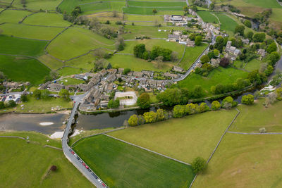 High angle view of field and buildings
