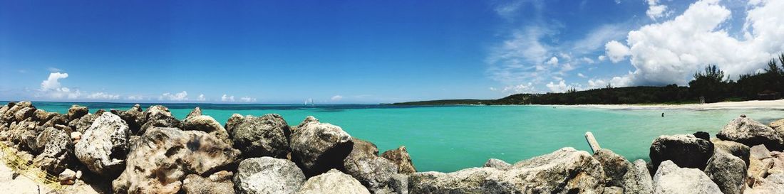 Panoramic view of sea against blue sky