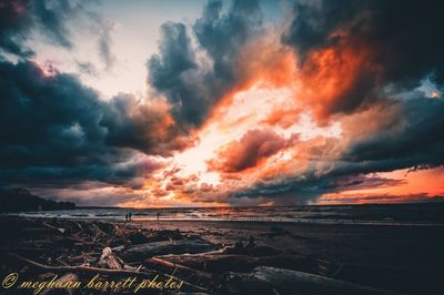 Scenic view of dramatic sky over sea during sunset