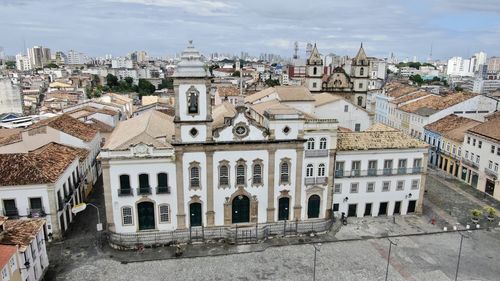 High angle view of buildings in town against sky