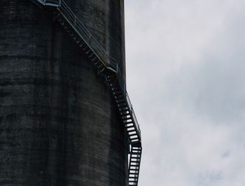 Low angle view of water tower against sky in city