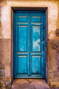 Close-up of closed blue door of building