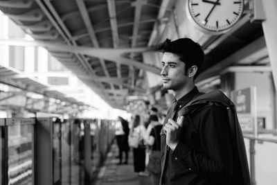 Side view of young man looking away