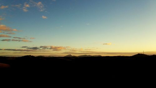 Scenic view of silhouette landscape against sky during sunset