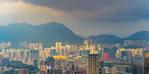 Panoramic view of buildings in city against sky during sunset