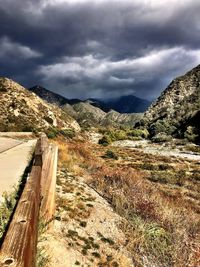 Scenic view of mountains against cloudy sky