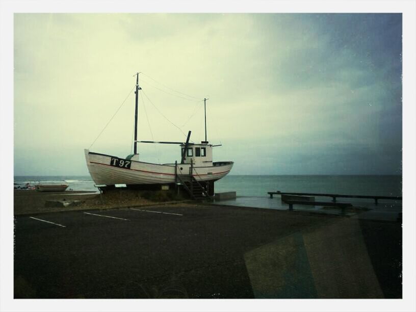 sea, transportation, nautical vessel, mode of transport, horizon over water, water, sky, transfer print, boat, moored, auto post production filter, cloud - sky, beach, nature, travel, cloud, beauty in nature, tranquil scene, tranquility, scenics