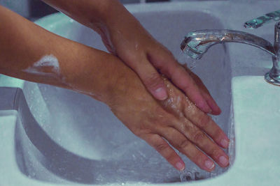 Close-up of woman hand in bathtub