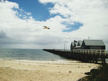 Silhouette of lighthouse on beach