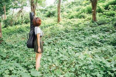 Rear view of woman in the forest