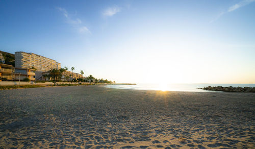 Scenic view of beach against sky during sunset